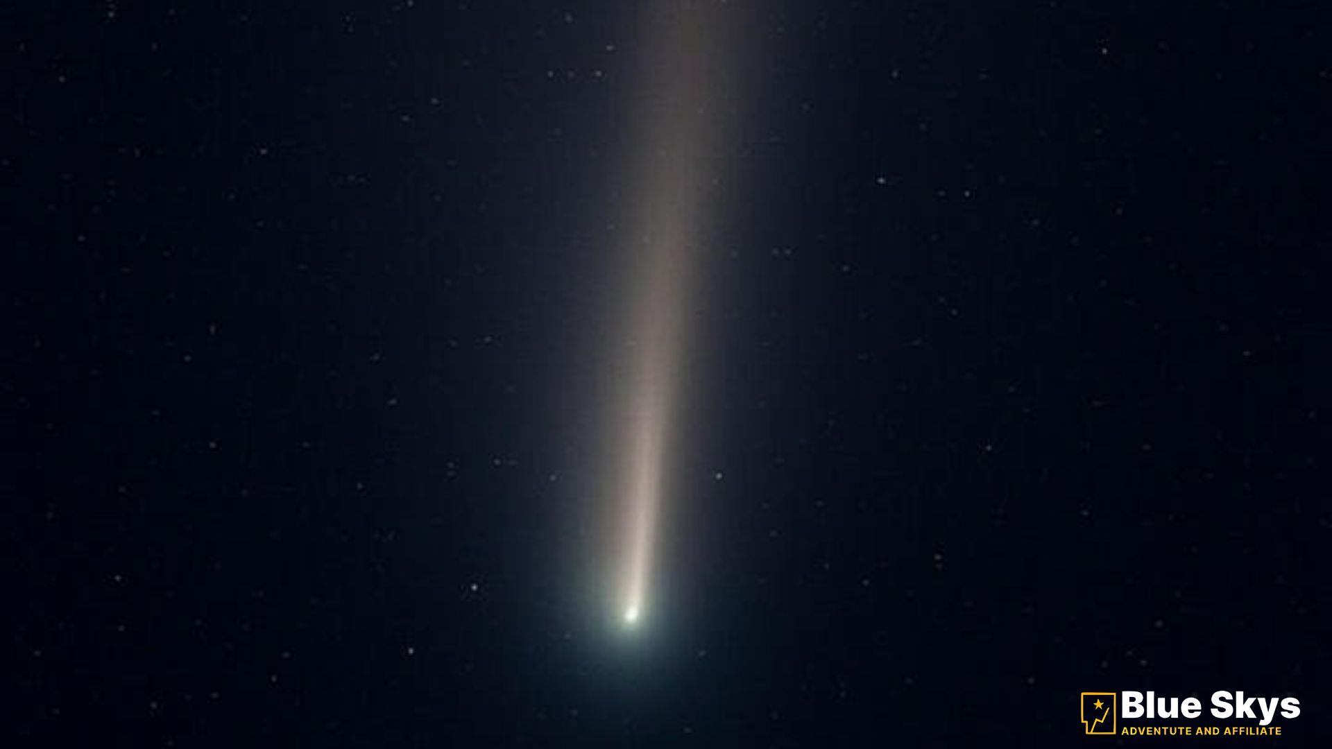 Comet 2P/Encke appears as a bright point with a faint tail in deep space, captured by a spacecraft camera.