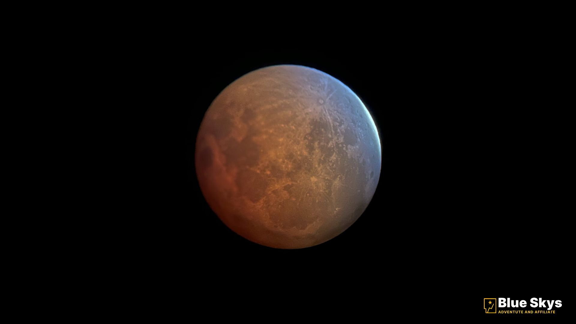 Bright Mars rising at sunset during its opposition, showing a clear red glow.